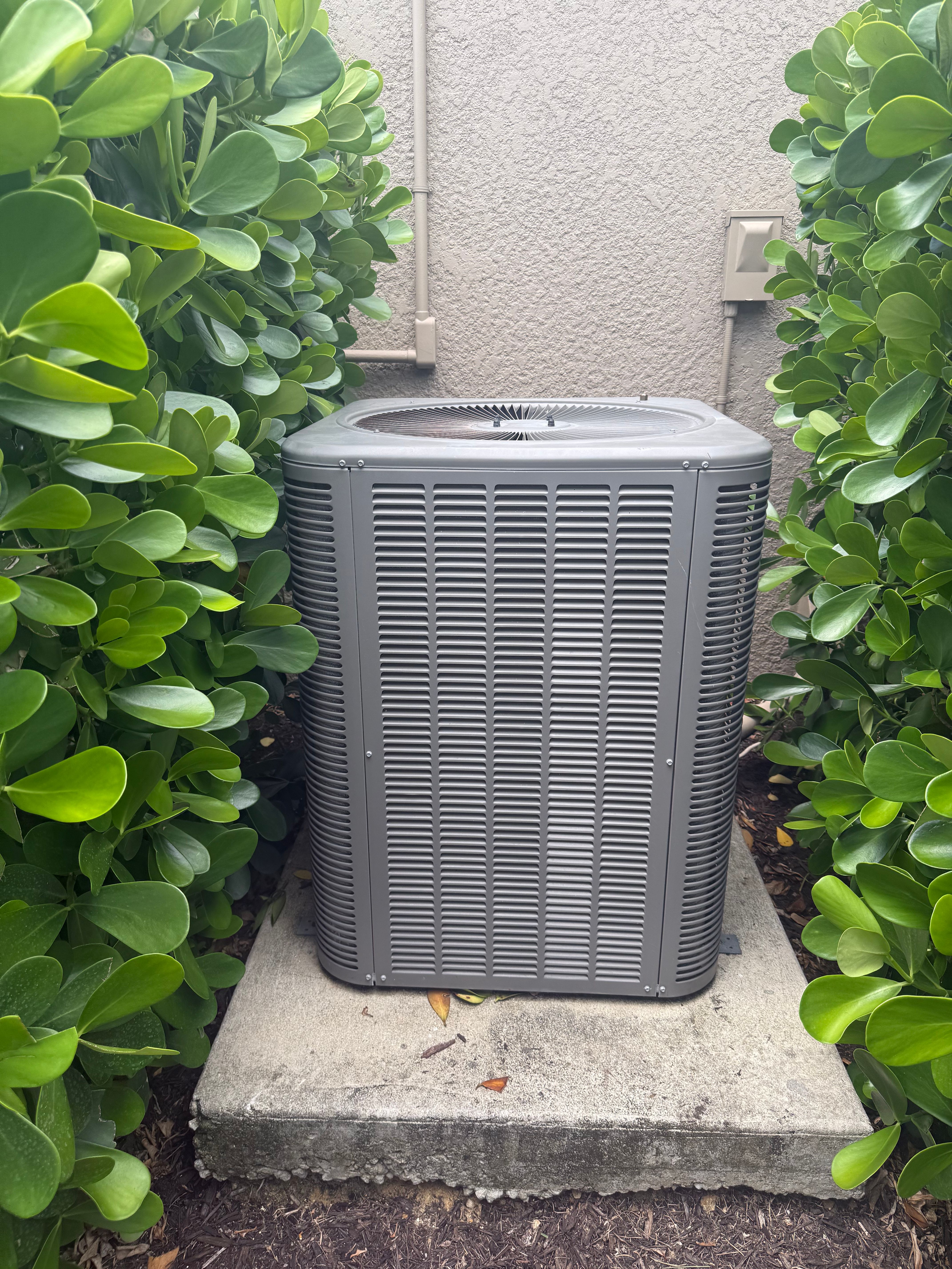 Condenser unit between bushes